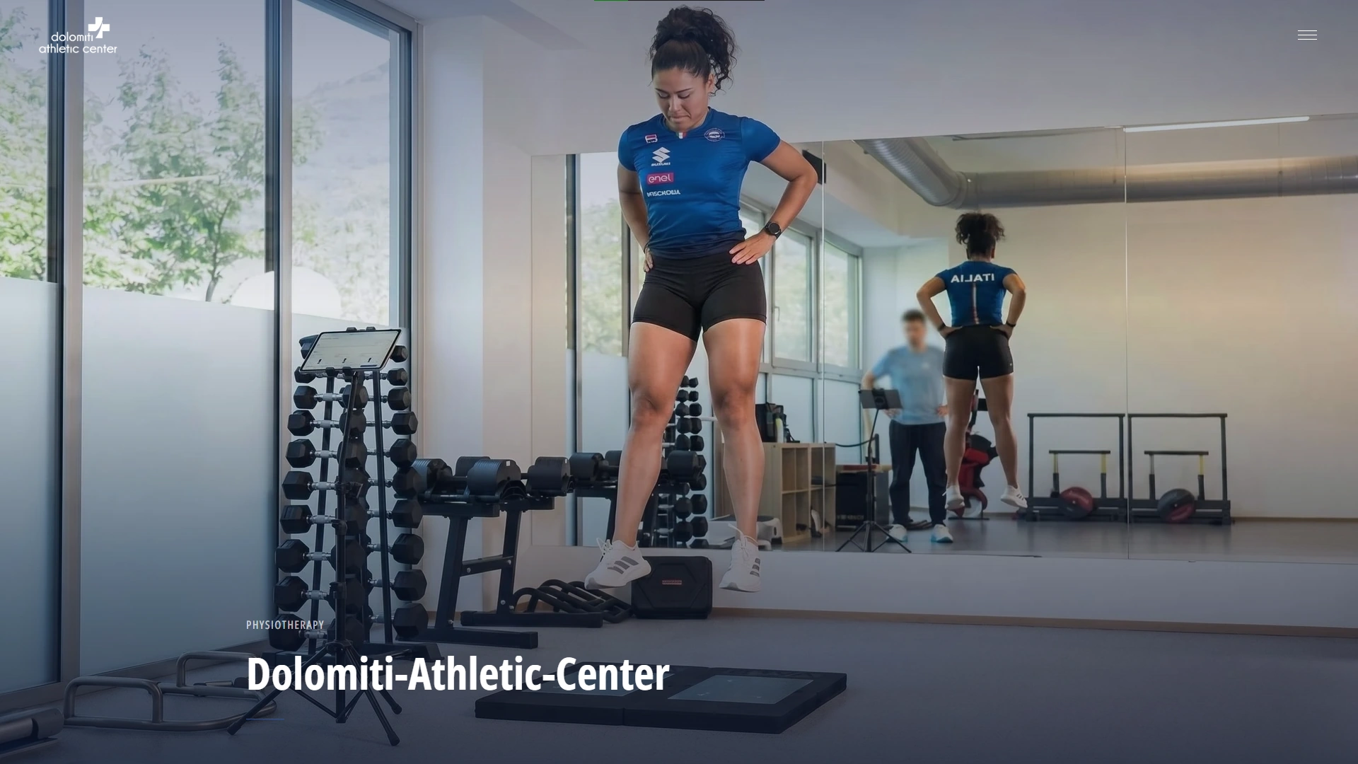 The Dolomiti Athletic Center website: an athlete training in the clinic's gym, the clinic wordmark and the site's opening title set over the photograph.
